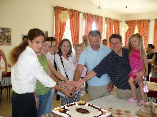 Volunteers Cutting the Cake