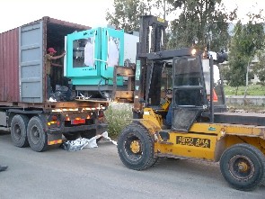 CNC Machine Being Unloaded